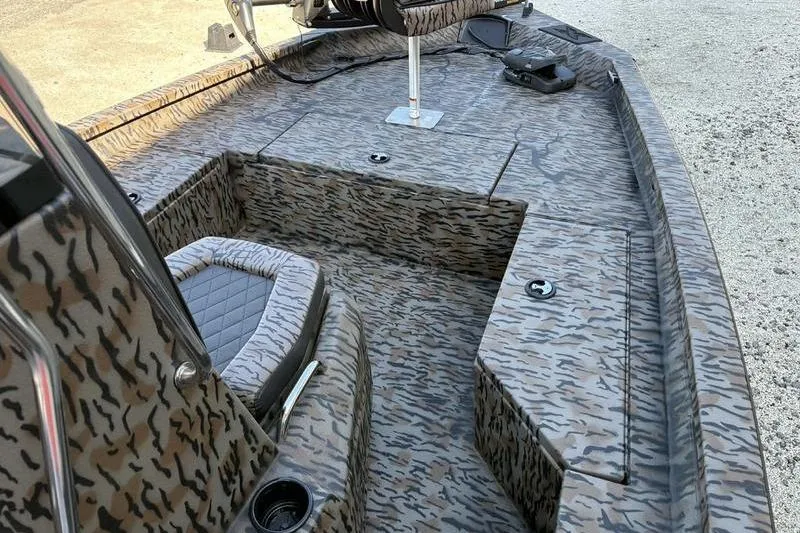 Slide: The Image of 2026 Xpress H20B Bay boat interior with camouflage pattern and seating. - 14