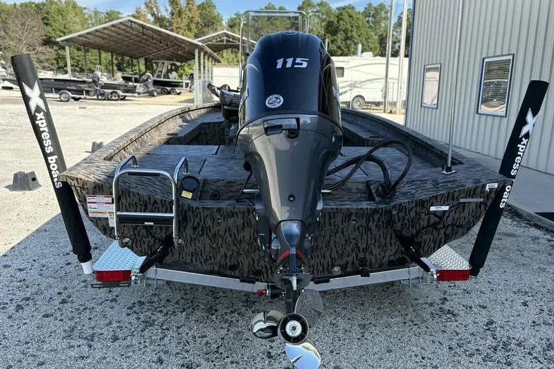 Slide: The Image of 2026 Xpress H20B Bay boat with 115 horsepower engine, parked outdoors. - 3