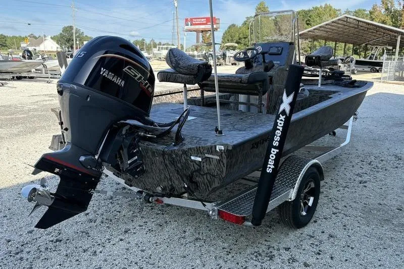 Slide: The Image of 2026 Xpress H20B Bay boat with Yamaha engine on a trailer. - 5