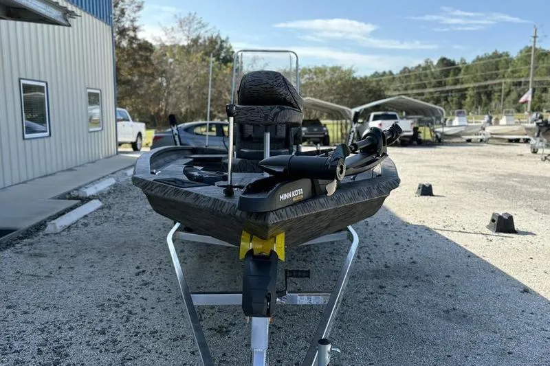 Slide: The Image of 2026 Xpress H20B Bay boat on trailer, parked outdoors. - 9