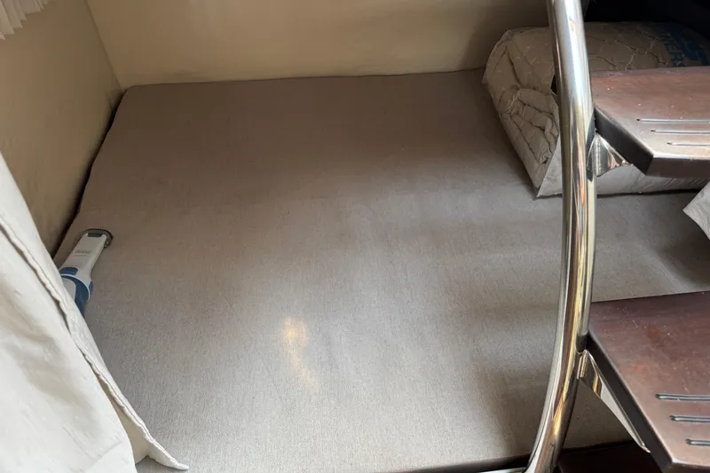 Slide: The Image of Interior cabin of 2018 Regal 28 Express boat with bedding and stairs. - 20