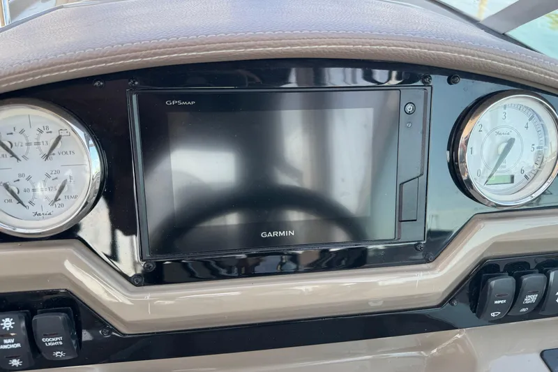 Slide: The Image of Dashboard of 2018 Regal 28 Express boat with Garmin GPS and gauges. - 7