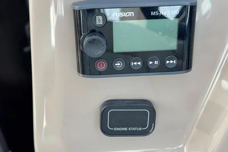 Slide: The Image of Control panel of a 2018 Regal 28 Express boat with Fusion MS-NRX300 display. - 8