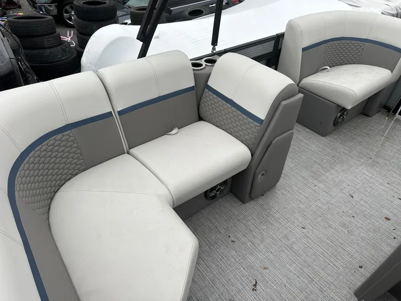 Slide: The Image of 2023 Qwest 816 Lanai LT boat interior with gray seating and textured upholstery. - 7