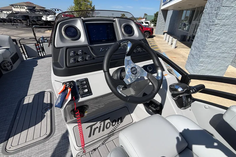 Slide: The Image of Interior view of 2026 JC Neptoon 25TT Sport boat dashboard and steering wheel. - 20