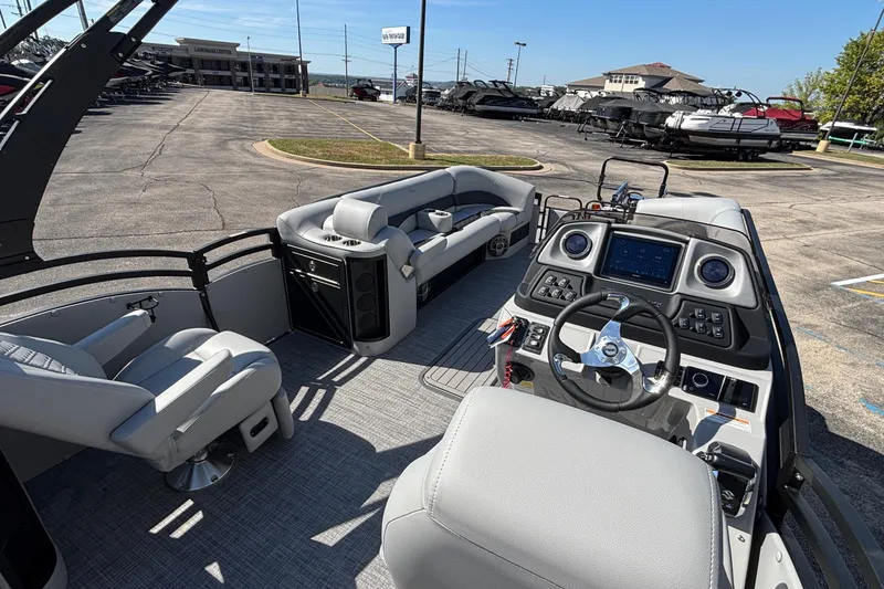 Slide: The Image of 2026 JC Neptoon 25TT Sport boat interior with modern dashboard and seating. - 22