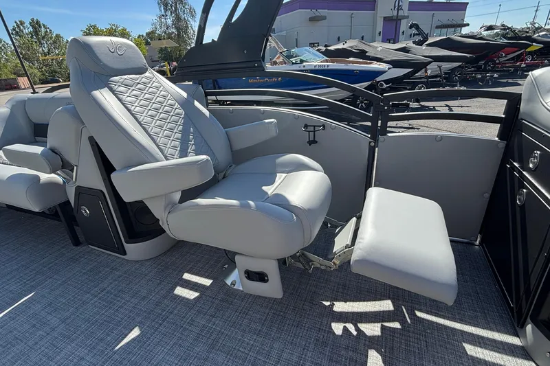 Slide: The Image of Luxurious seating on 2026 JC Neptoon 25TT Sport pontoon boat, featuring plush gray upholstery. - 33