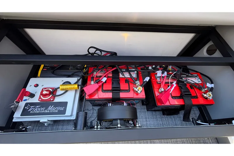 Slide: The Image of Battery compartment of 2026 JC Neptoon 25TT Sport with control center and wiring. - 8