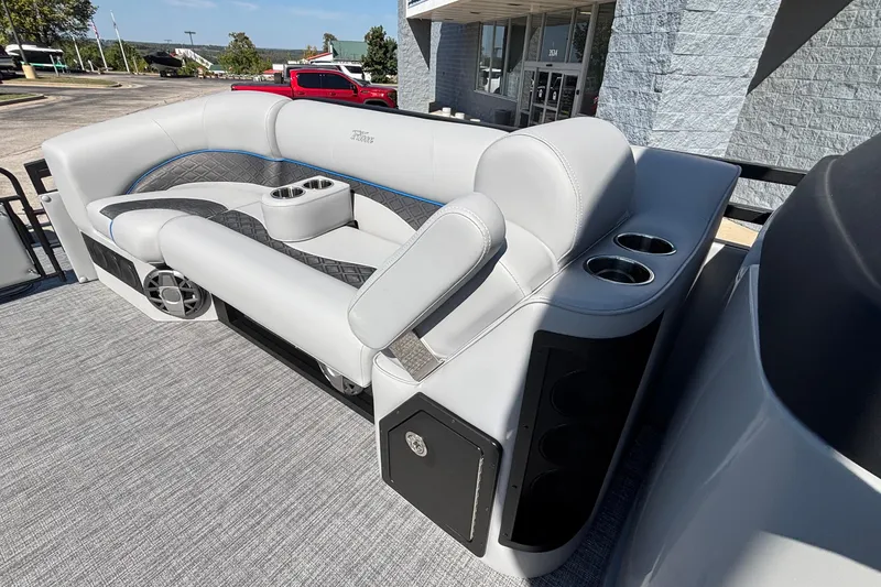 Slide: The Image of Luxurious seating on 2026 JC Neptoon 25TT Sport pontoon boat with cup holders and speakers. - 12