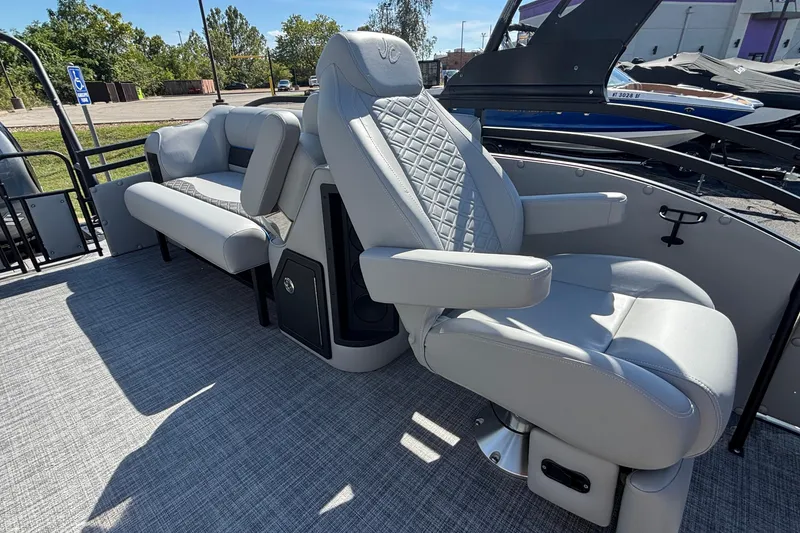 Slide: The Image of Luxurious seating on 2026 JC Neptoon 25TT Sport pontoon boat, featuring plush gray upholstery. - 26
