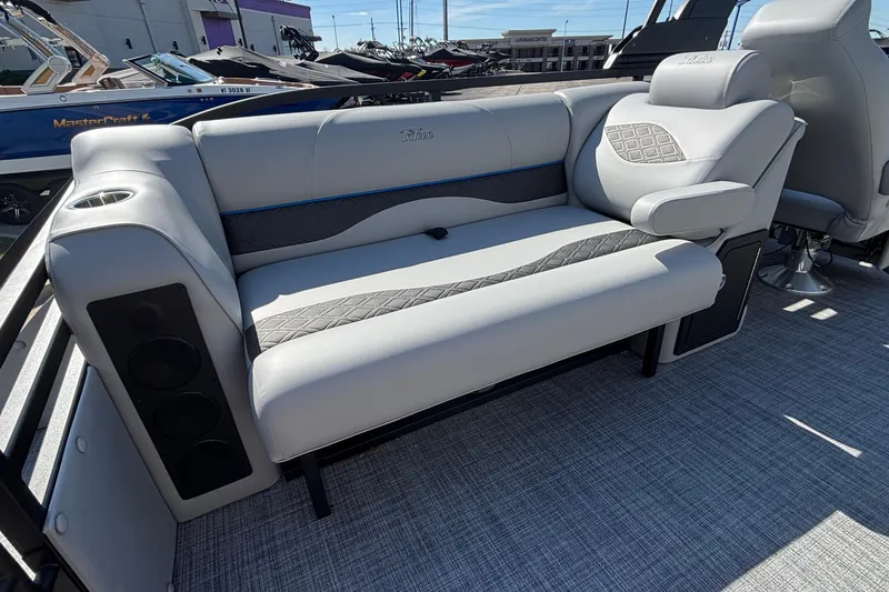 Slide: The Image of Luxurious seating on 2026 JC Neptoon 25TT Sport pontoon boat, featuring stylish upholstery and integrated speakers. - 29
