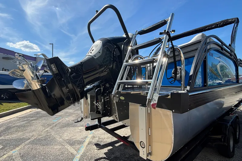 Slide: The Image of 2026 JC Neptoon 25TT Sport pontoon boat with powerful outboard motor and sleek design. - 3