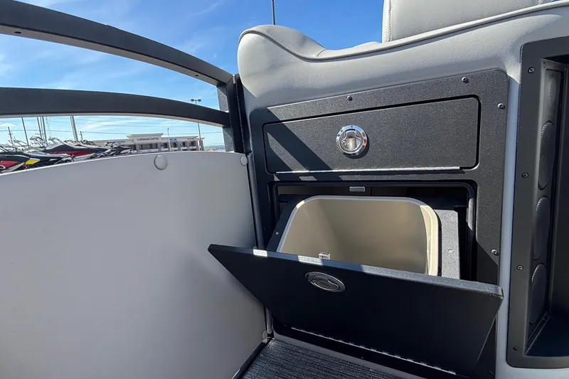 Slide: The Image of Interior of 2026 JC Neptoon 25TT Sport boat with open storage compartment. - 34