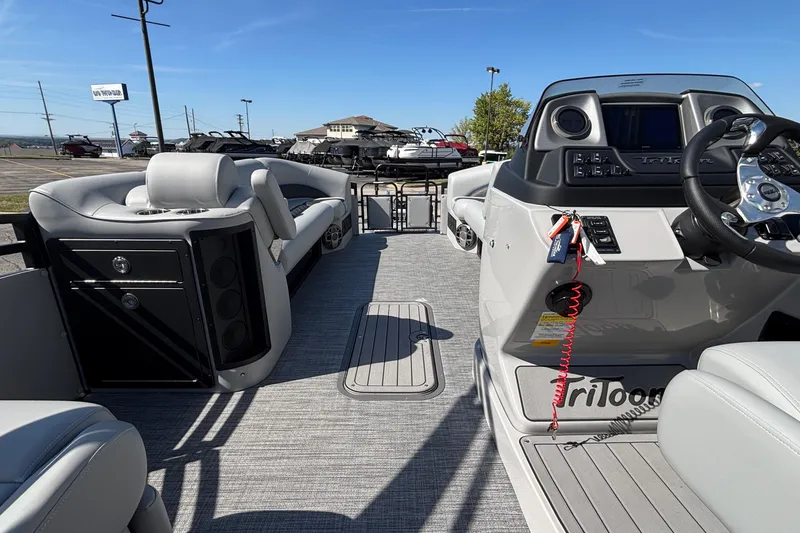 Slide: The Image of 2026 JC Neptoon 25TT Sport pontoon boat interior with modern seating and control panel. - 9