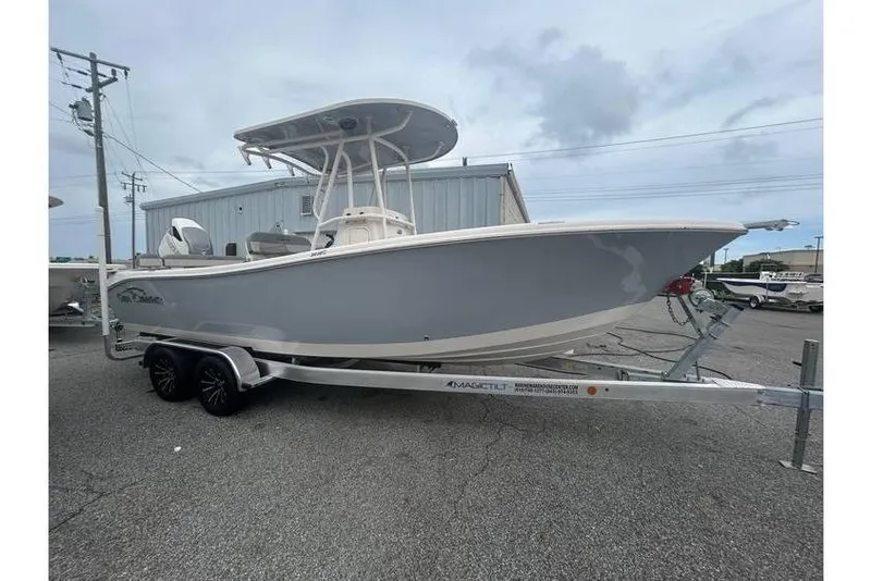 The Image of 2024 Sea Chaser 24 HFC boat on trailer, parked outdoors near a building. - 0