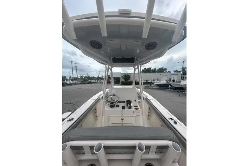 Slide: The Image of 2024 Sea Chaser 24 HFC boat interior with helm, seating, and overhead speakers. - 5