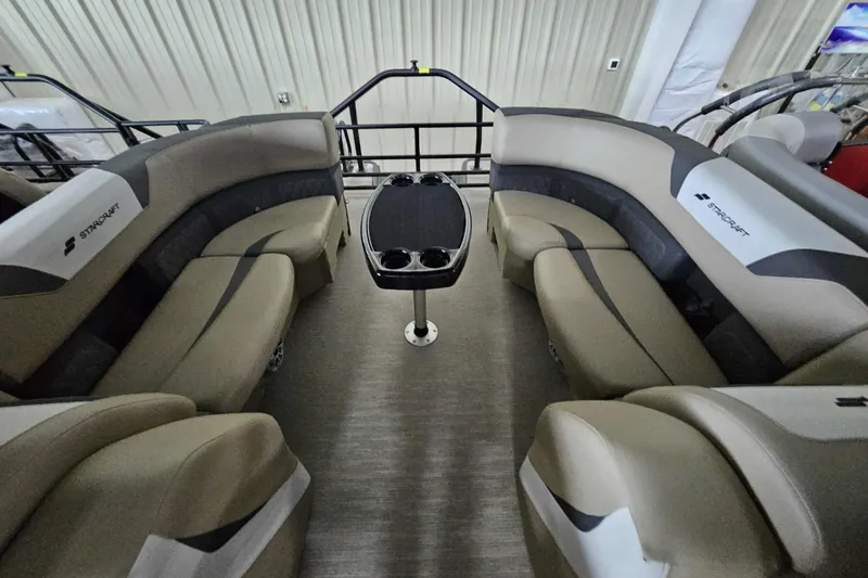 Slide: The Image of 2026 Starcraft SLS 3 R boat interior with luxurious seating and central table. - 10