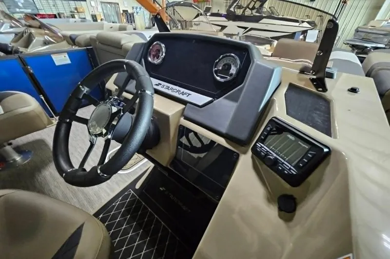 Slide: The Image of 2026 Starcraft SLS 3 R boat dashboard with steering wheel and control panel. - 15