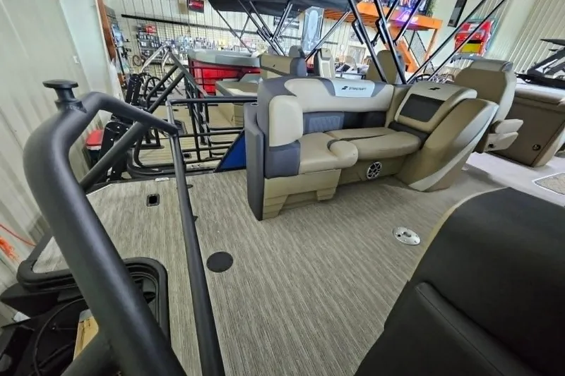 Slide: The Image of Interior of 2026 Starcraft SLS 3 R pontoon boat with beige seating and modern design. - 16