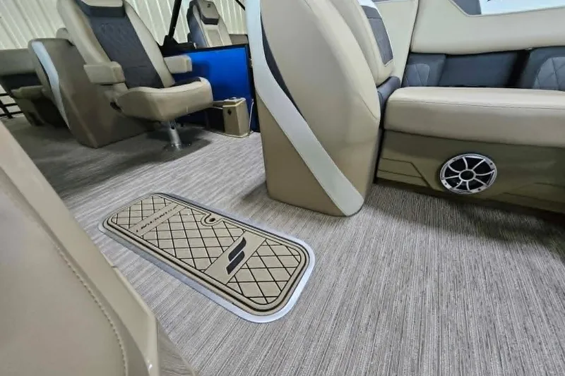 Slide: The Image of Interior of 2026 Starcraft SLS 3 R boat with beige seating and floor storage. - 19