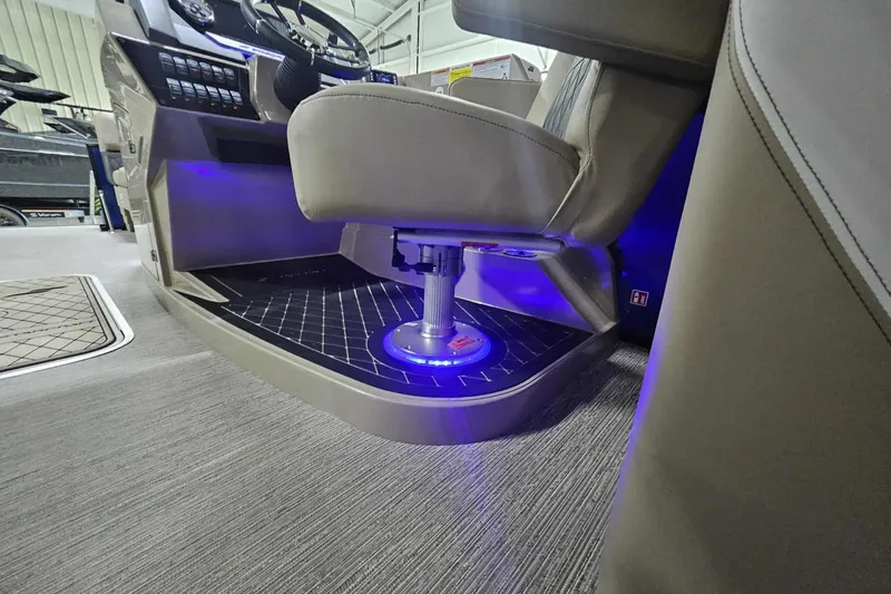 Slide: The Image of 2026 Starcraft SLS 3 R boat interior with illuminated captain's seat and modern dashboard. - 8