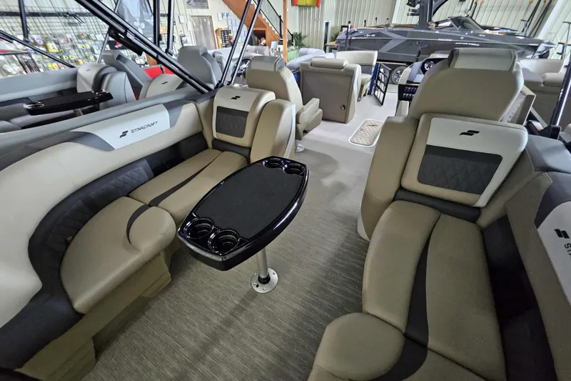 Slide: The Image of 2026 Starcraft SLS 3 R boat interior with luxurious seating and central table. - 9
