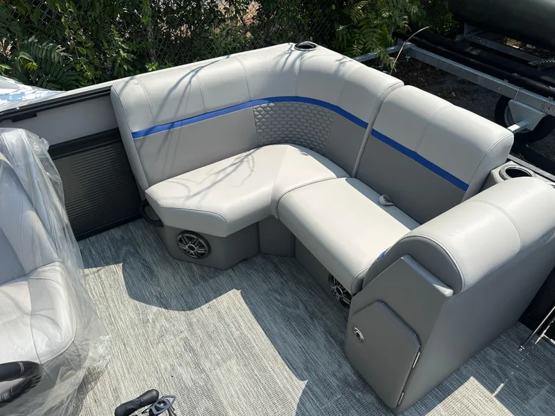 Slide: The Image of 2023 Qwest 816 Lanai LT boat interior with gray seating and blue accents. - 5