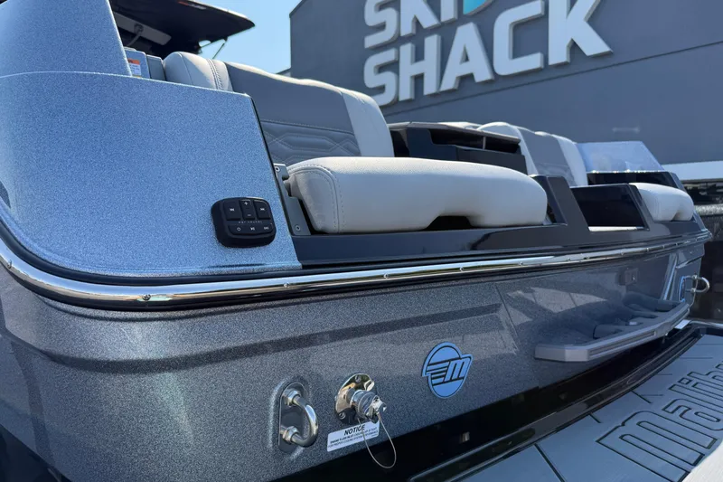 Slide: The Image of 2026 Malibu Wakesetter 26 LSV boat at Ski Shack, showcasing sleek design and seating. - 11