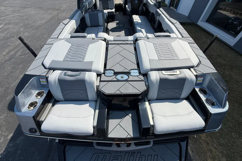 Slide: The Image of 2026 Malibu Wakesetter 26 LSV boat interior with luxurious seating and cup holders. - 12