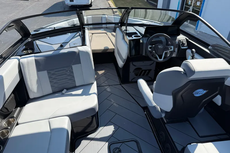 Slide: The Image of 2026 Malibu Wakesetter 26 LSV interior with modern seating and sleek dashboard design. - 15