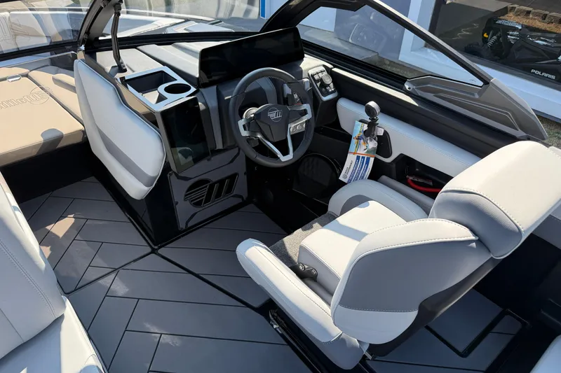 Slide: The Image of 2026 Malibu Wakesetter 26 LSV interior with modern dashboard and seating. - 16