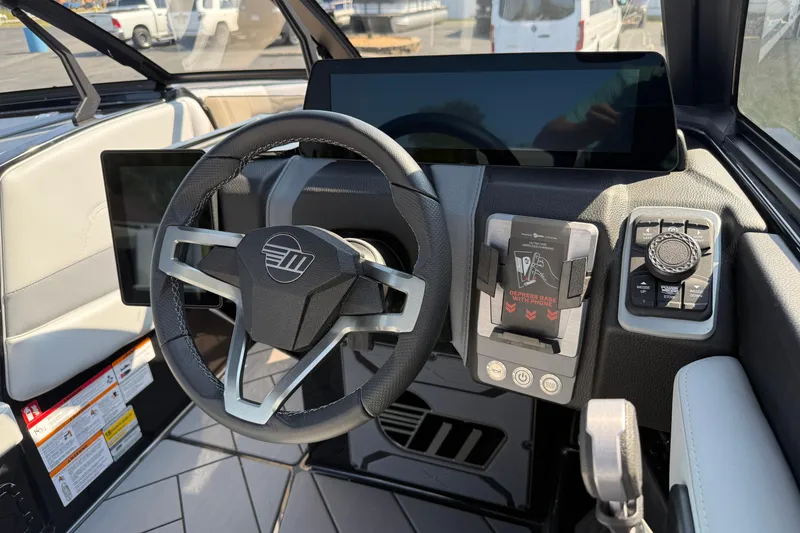 Slide: The Image of 2026 Malibu Wakesetter 26 LSV dashboard with modern steering wheel and digital controls. - 18