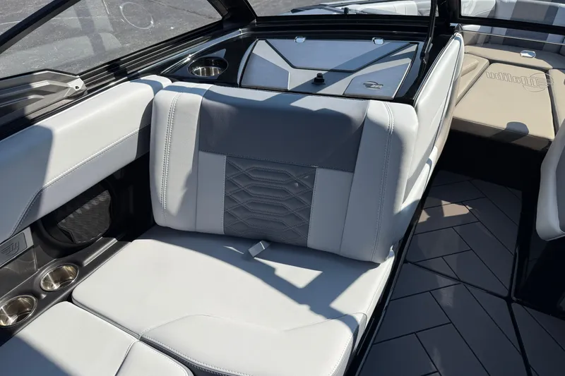 Slide: The Image of 2026 Malibu Wakesetter 26 LSV interior with luxurious seating and cup holders. - 19