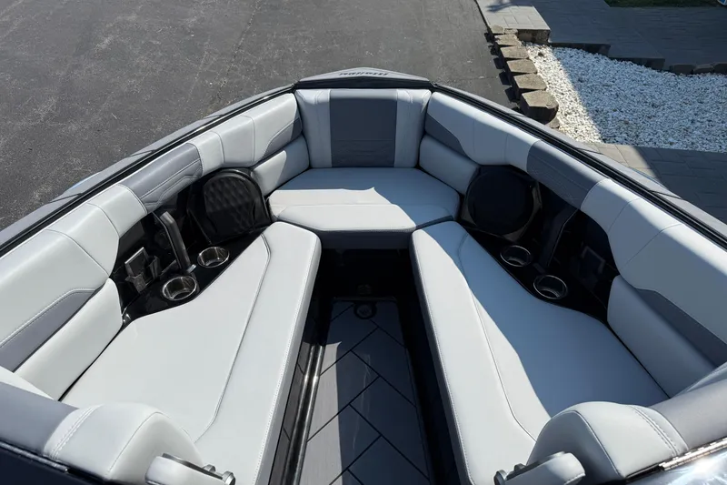 Slide: The Image of 2026 Malibu Wakesetter 26 LSV boat interior with luxurious seating and cup holders. - 21