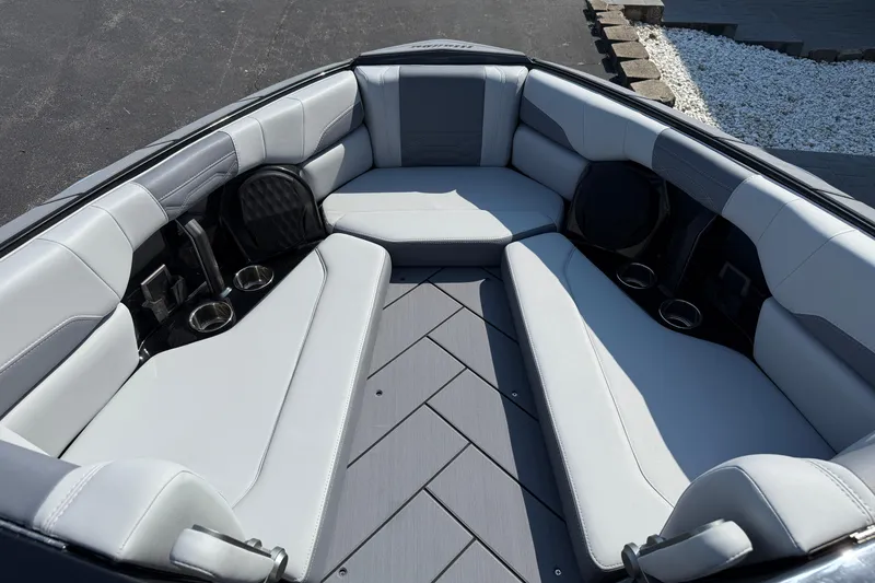 Slide: The Image of 2026 Malibu Wakesetter 26 LSV interior with luxurious seating and cup holders. - 22