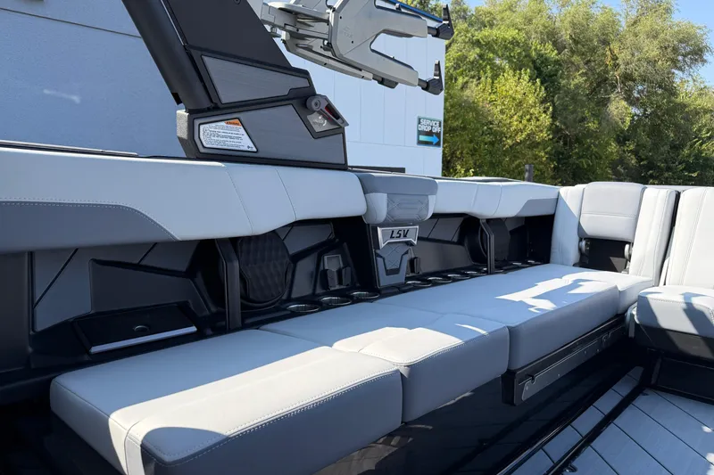 Slide: The Image of 2026 Malibu Wakesetter 26 LSV interior seating with sleek, modern design and ample space. - 26