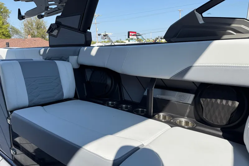 Slide: The Image of 2026 Malibu Wakesetter 26 LSV interior with sleek seating and cup holders. - 27
