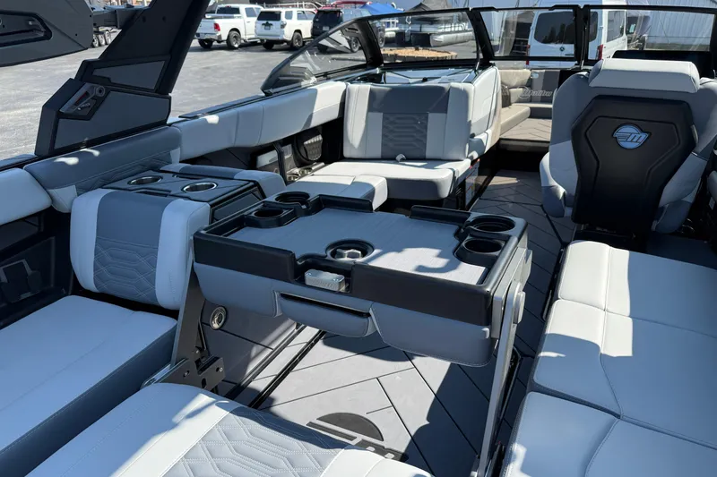 Slide: The Image of 2026 Malibu Wakesetter 26 LSV interior with luxurious seating and cup holders. - 35