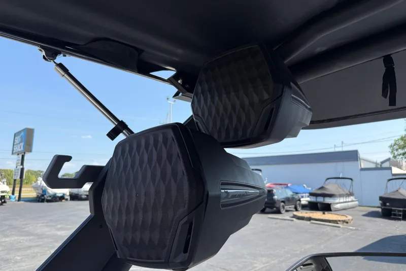 Slide: The Image of 2026 Malibu Wakesetter 26 LSV boat speakers, close-up view, outdoor setting. - 36