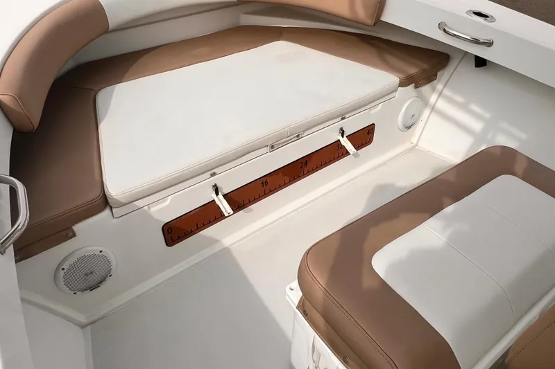 Slide: The Image of Interior seating of 2018 Parker 2100 Special Edition boat with tan and white cushions. - 5