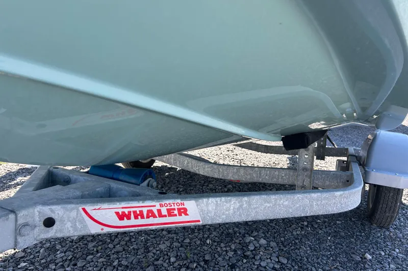 Slide: The Image of 2023 Boston Whaler 130 Super Sport on trailer, close-up view. - 22