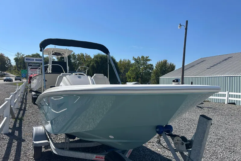 Slide: The Image of 2023 Boston Whaler 130 Super Sport boat on trailer at Morgan Marine dealership. - 8