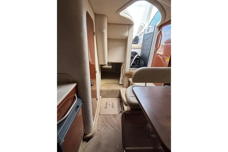 Slide: The Image of Interior view of 2008 Sea Ray 290 Sundancer cabin with seating and table. - 22