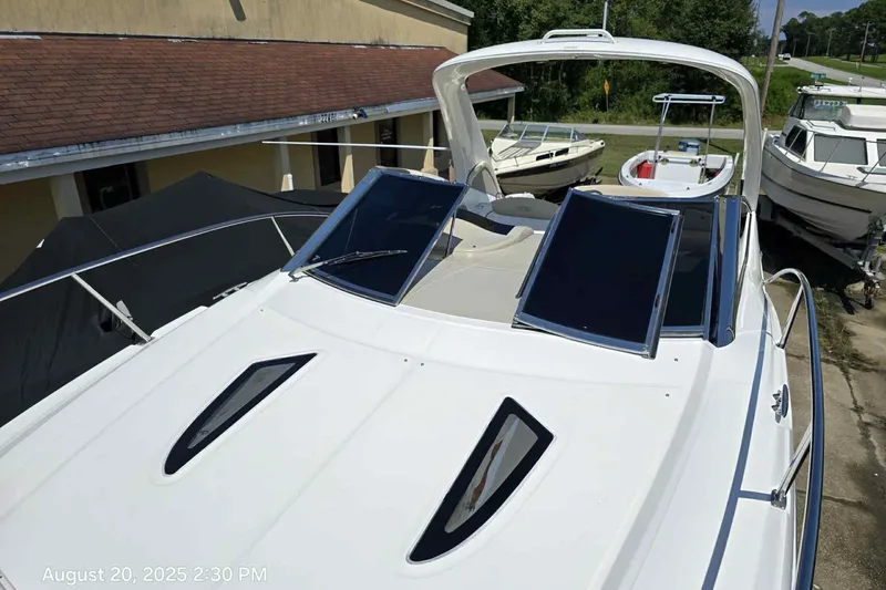 Slide: The Image of 2008 Sea Ray 290 Sundancer boat displayed outdoors on a sunny day. - 3