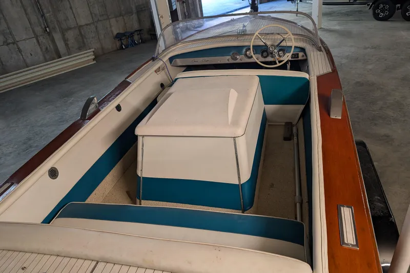 Slide: The Image of 1967 Chris-Craft 17 Sportsman boat interior with vintage steering wheel and seating. - 4