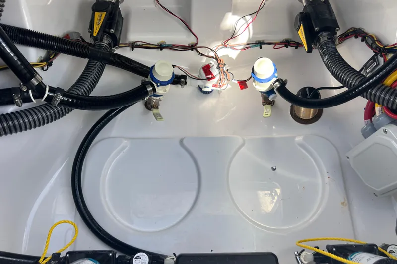 Slide: The Image of 2026 Sportsman Masters 247 Bay Boat wiring and plumbing components. - 17