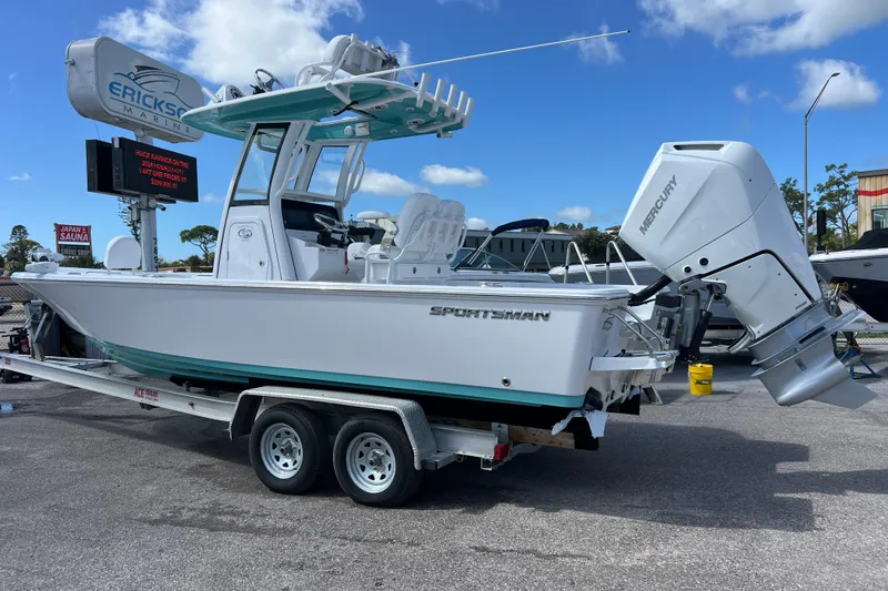 Slide: The Image of 2026 Sportsman Masters 247 Bay Boat on trailer, featuring Mercury outboard engine. - 3