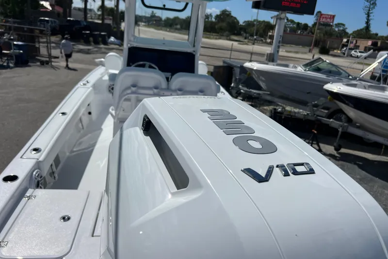 Slide: The Image of 2026 Sportsman Masters 247 Bay Boat with powerful V10 engine, displayed outdoors. - 5