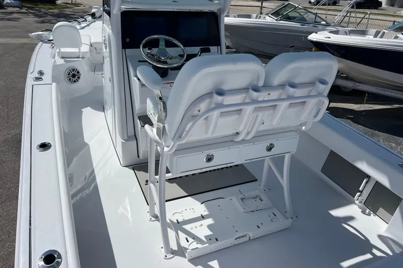 Slide: The Image of 2026 Sportsman Masters 247 Bay Boat interior with dual seating and steering console. - 7