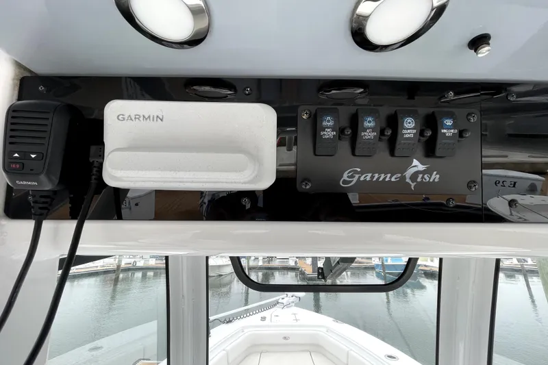 Slide: The Image of 2021 Sea Hunt Gamefish 27 dashboard with Garmin device and control panel. - 15